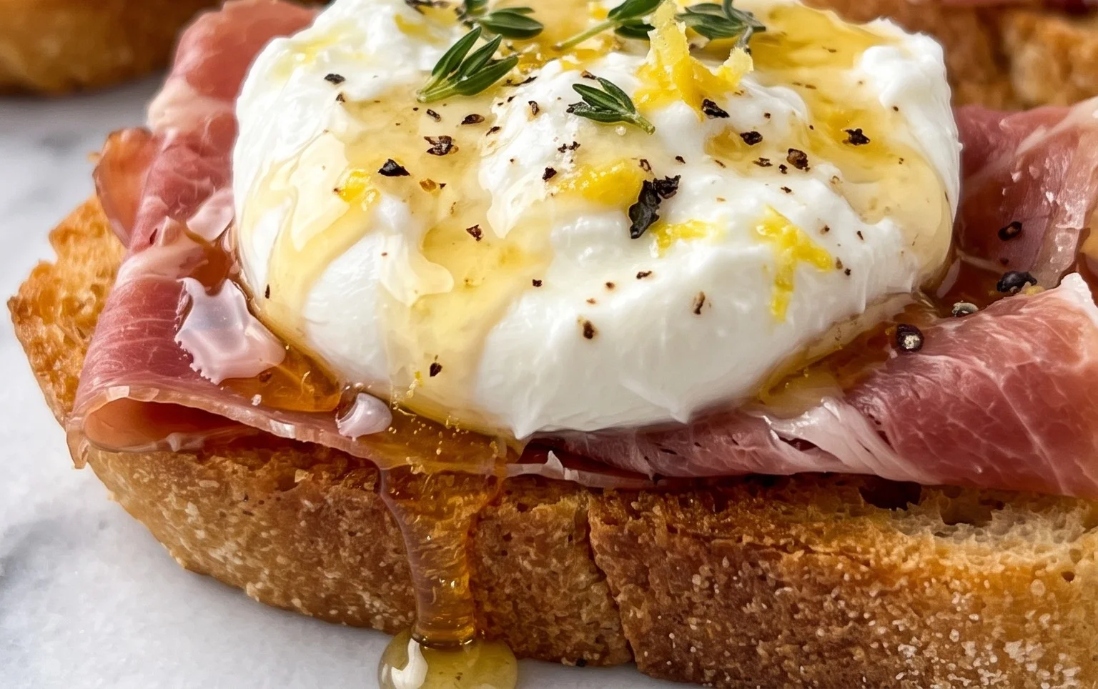 Beef Prosciutto Crostini with Burrata and Lemon Honey Drizzle